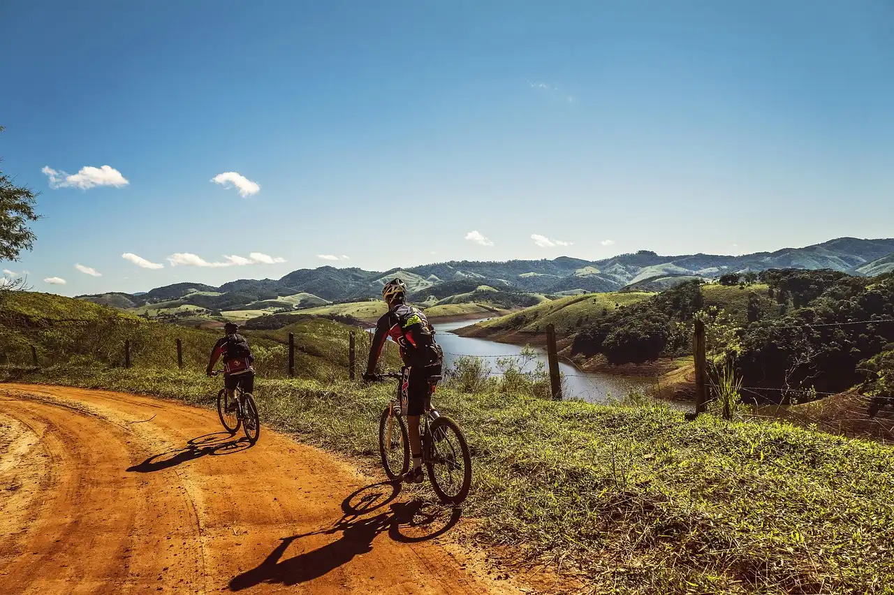 Login Image of two Cyclist in a Field